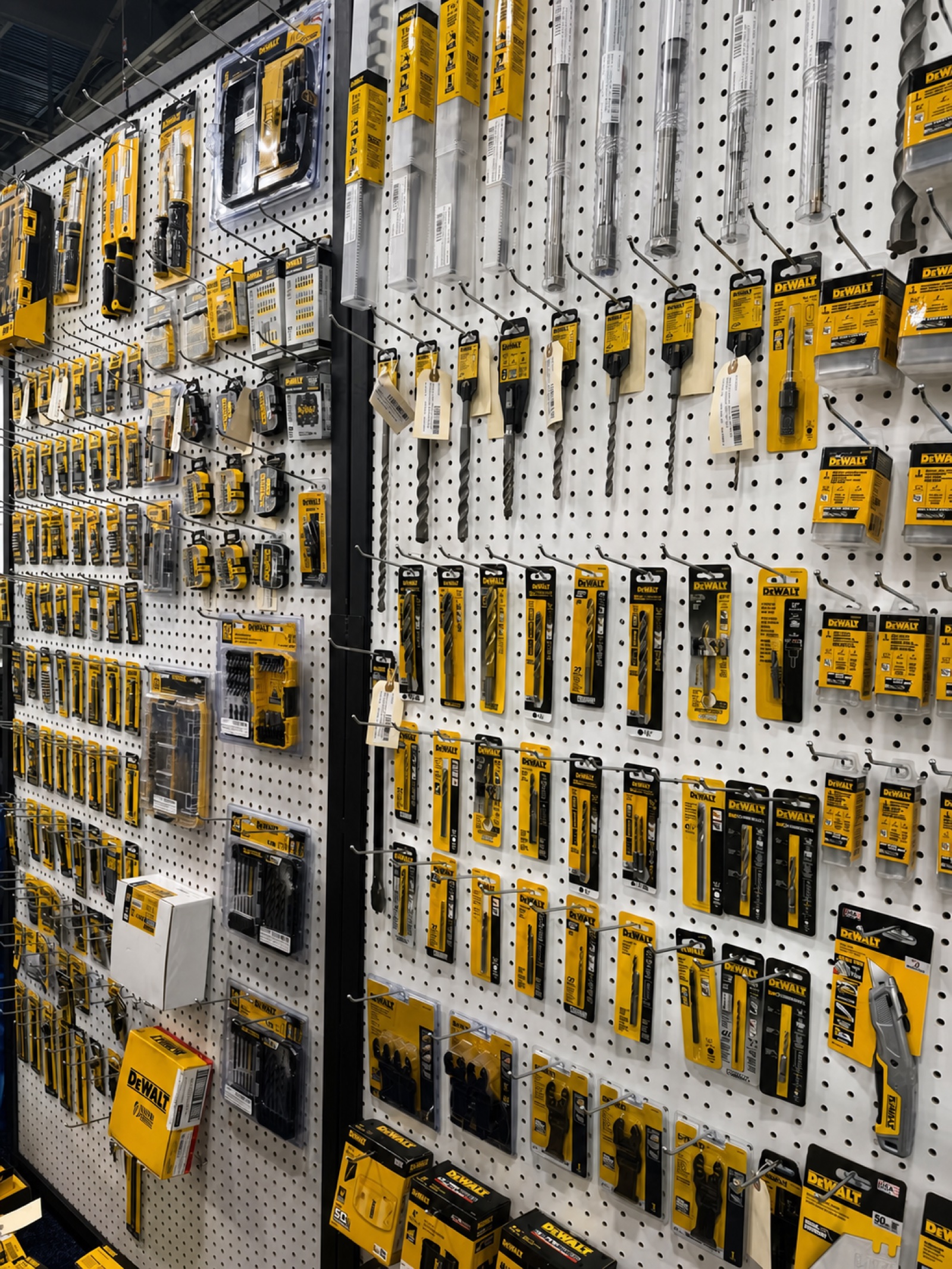 DeWalt tools displayed on a retail pegboard wall