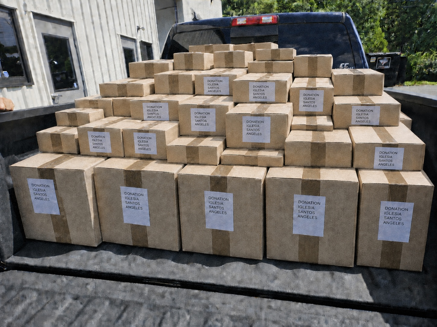 Supersonic Supply team loading donated goods for delivery